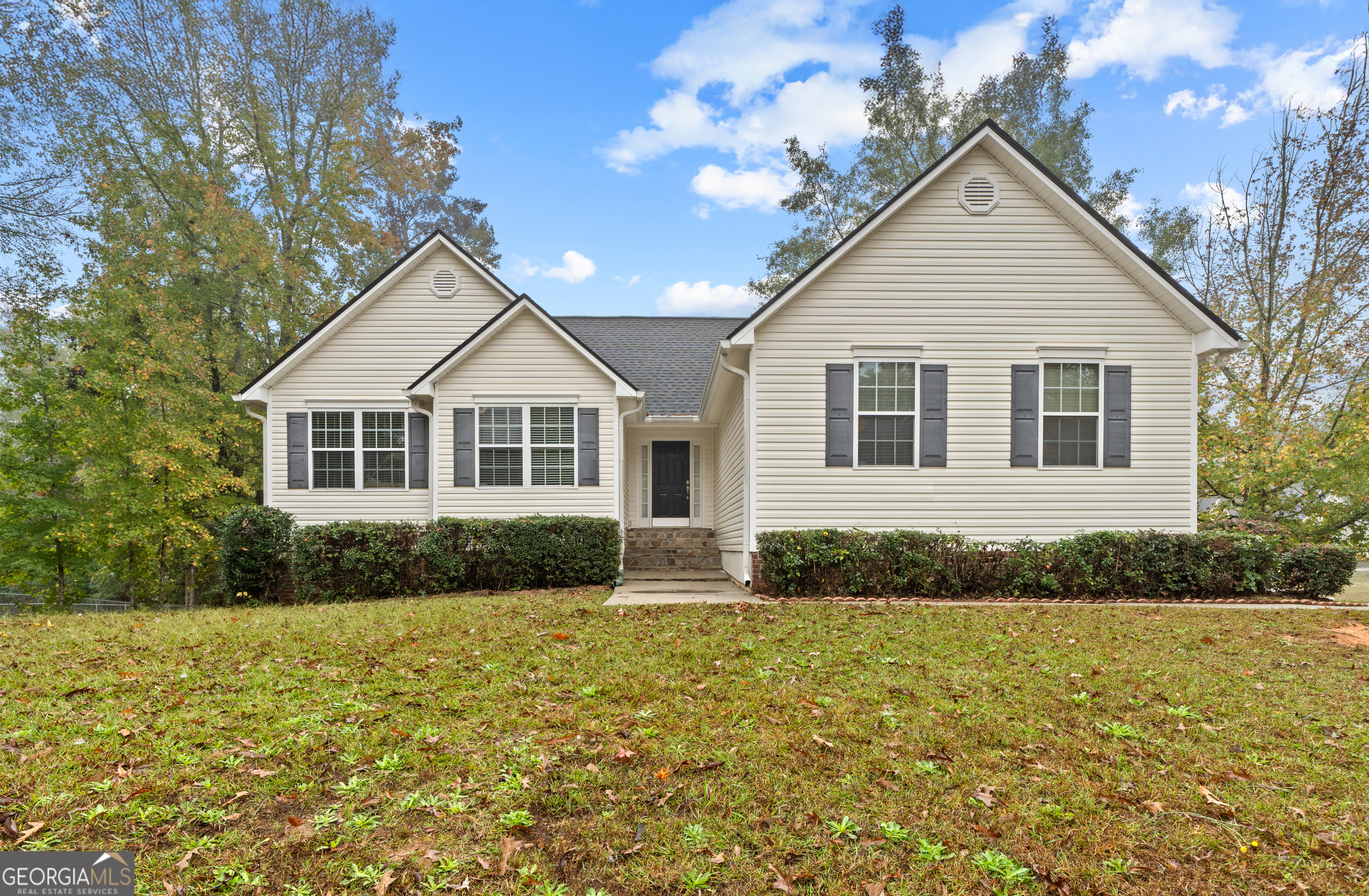 a front view of a house with a yard