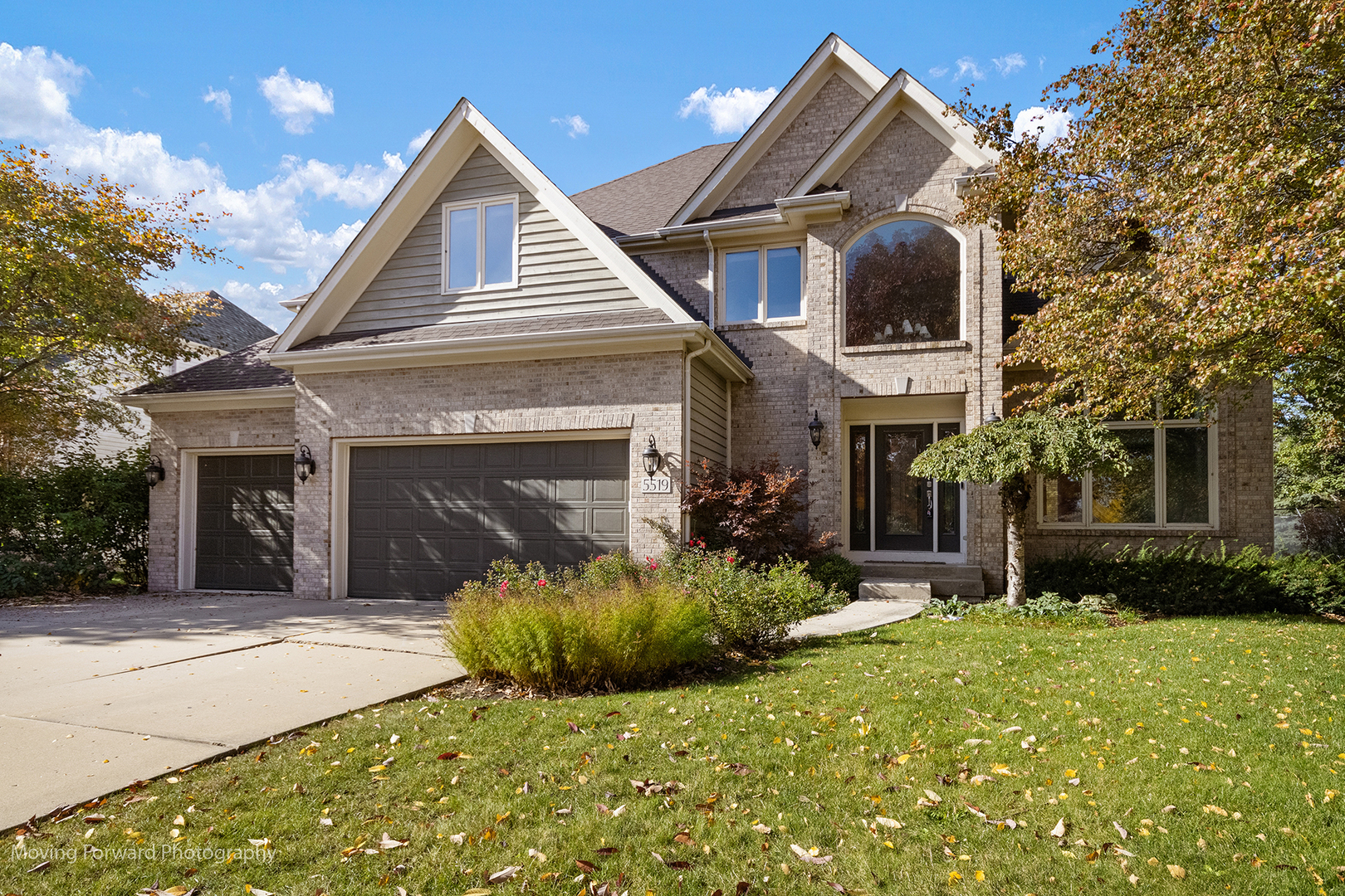 front view of a house with a yard