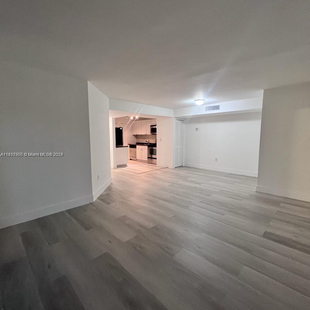 a view of a livingroom with wooden floor