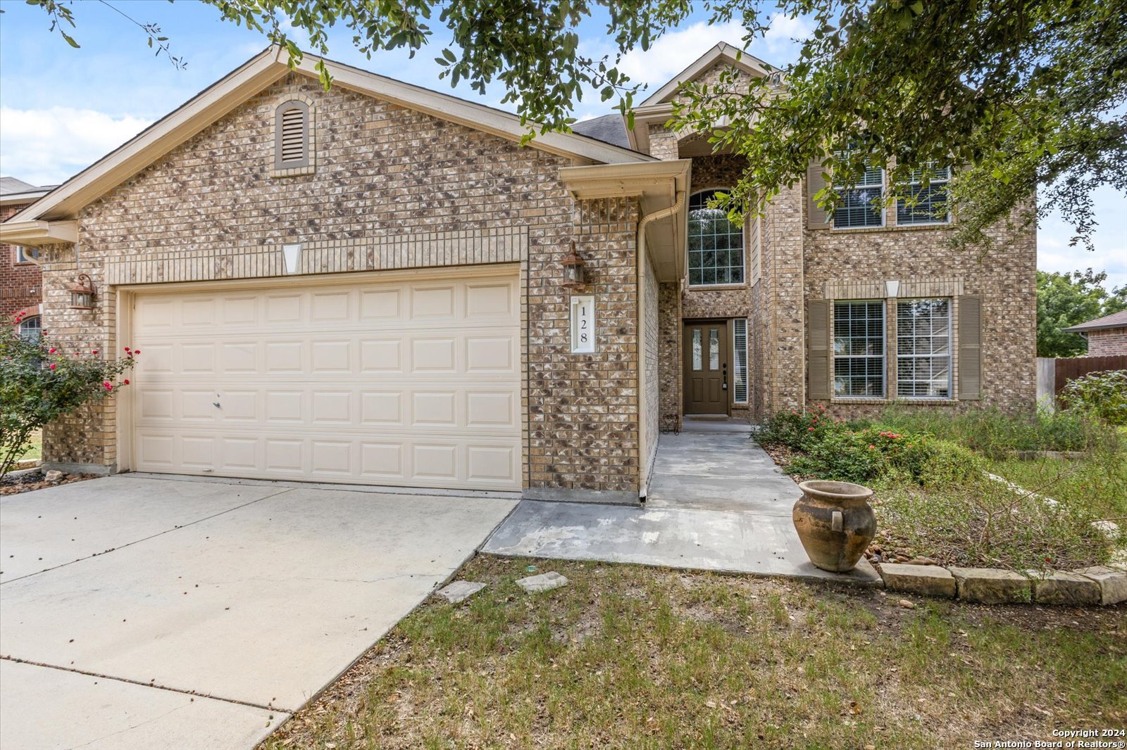 front view of a house with a yard