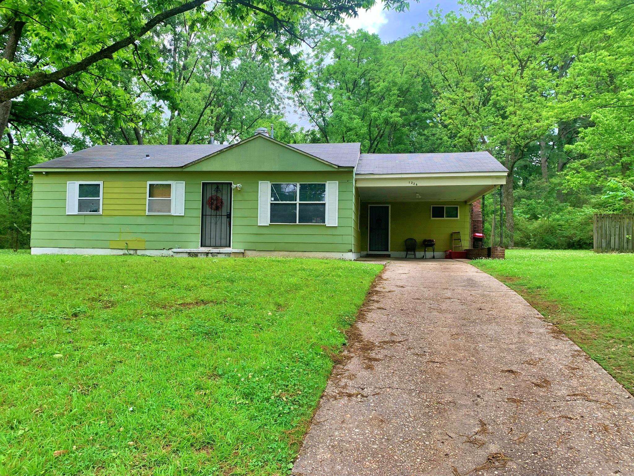 a front view of a house with yard