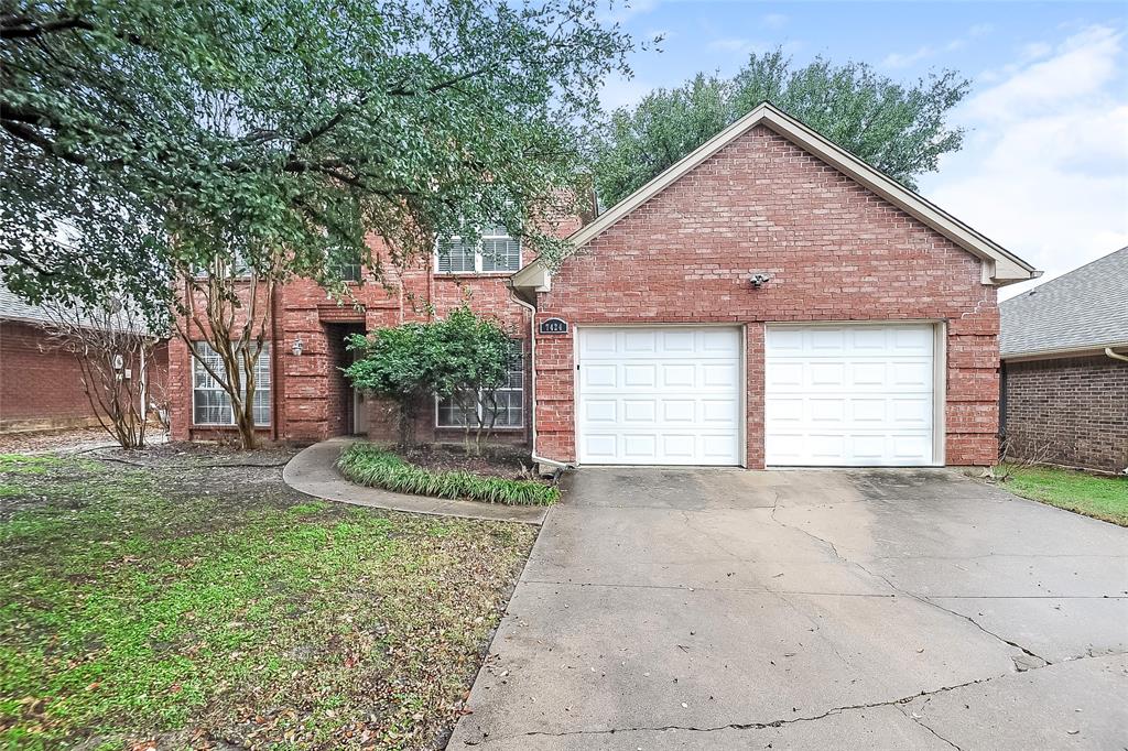 a view of a house with a yard and garage