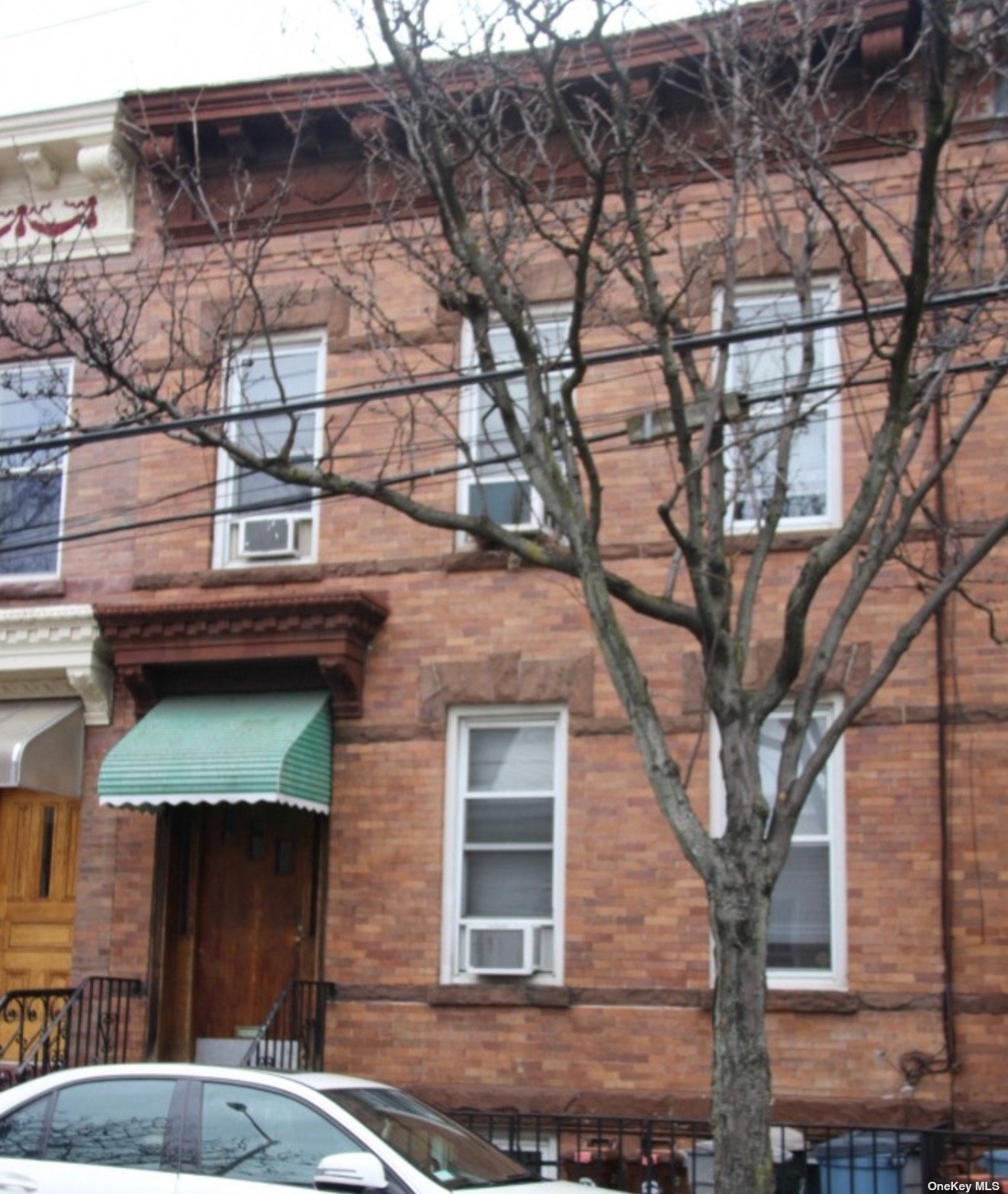 a front view of a house with parking space