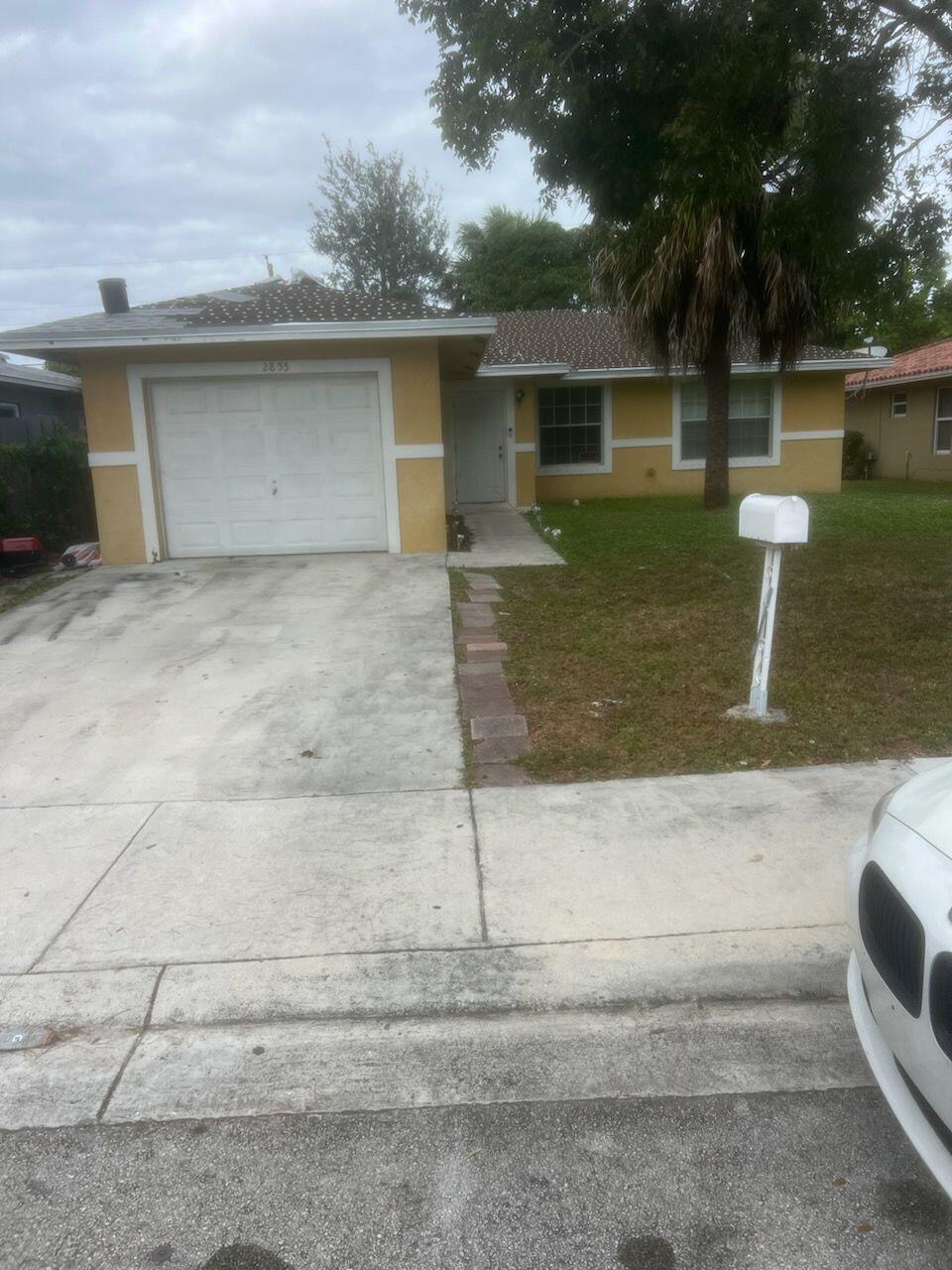 a front view of a house with garage