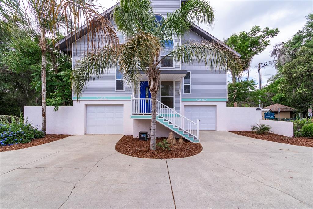 a front view of a house with garage