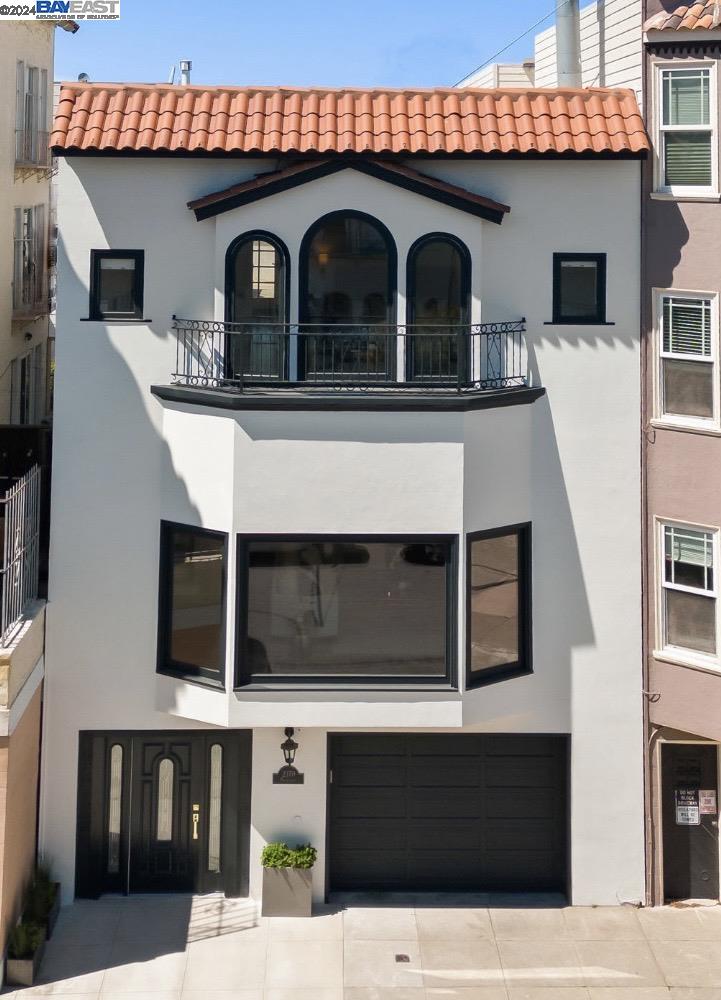 a front view of a house with a balcony