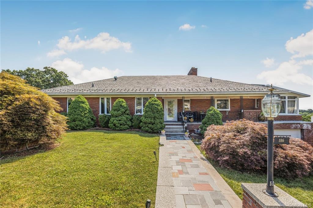 a front view of a house with garden