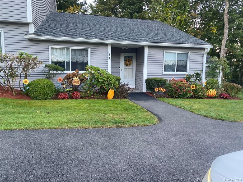 View of front of property with a front yard