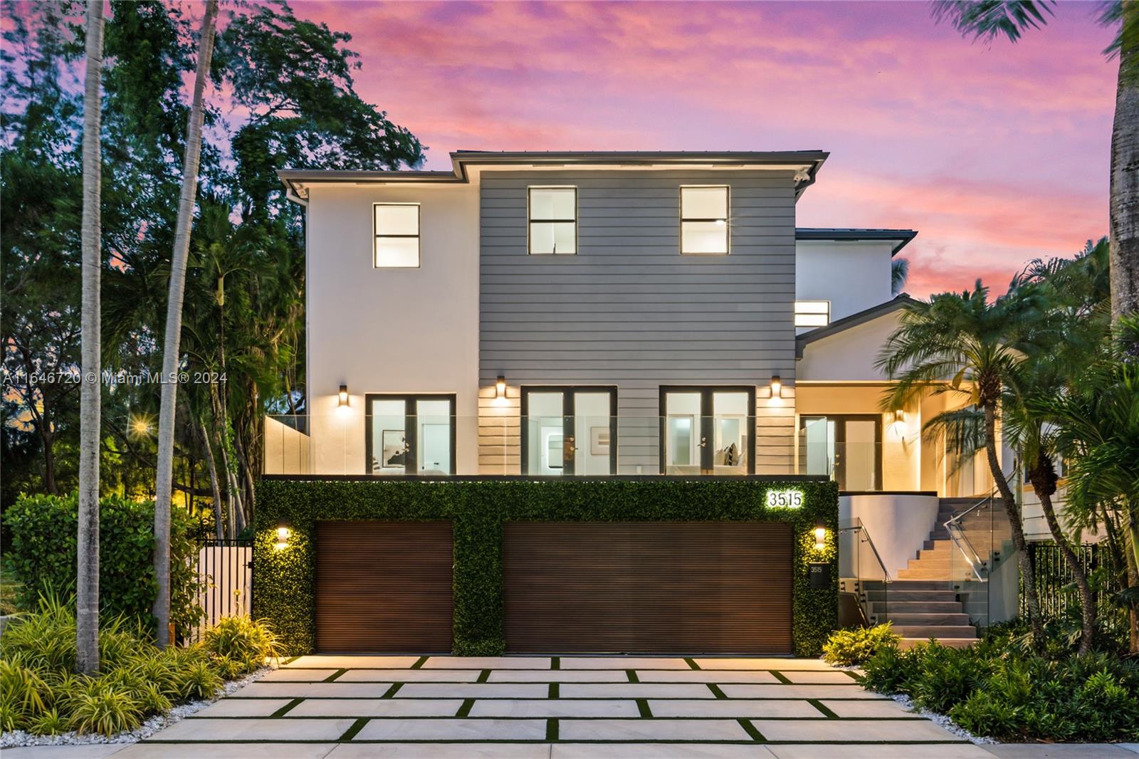 a front view of a house with a garden