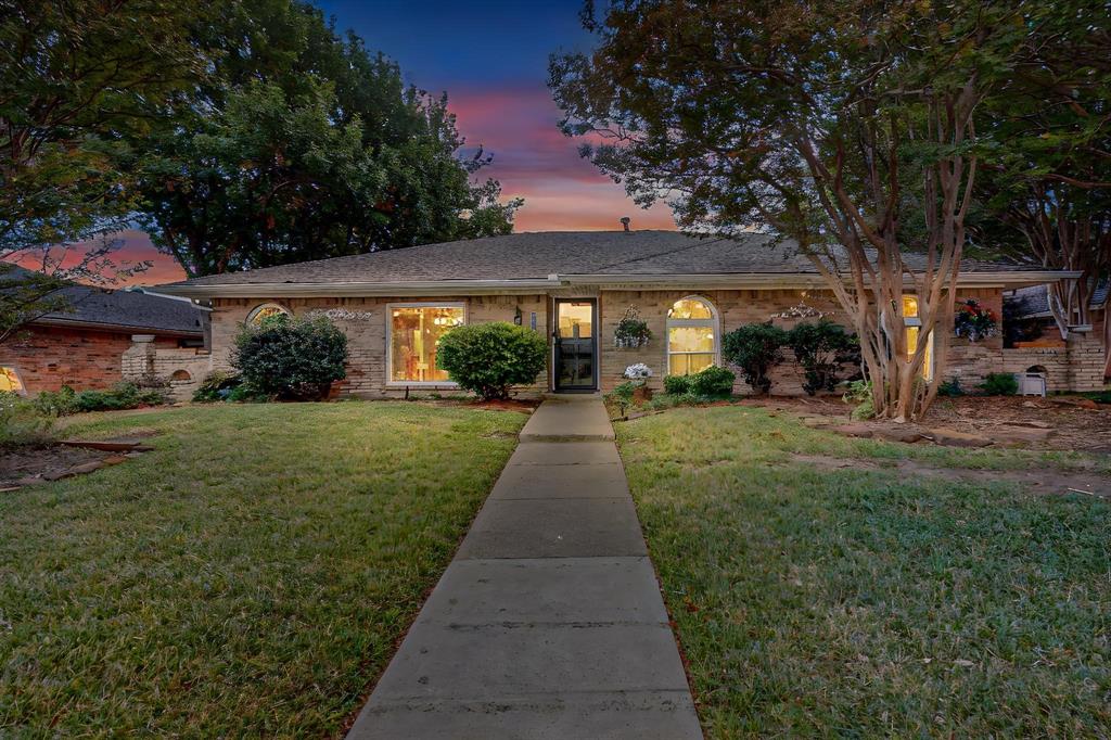 front view of a house with a yard