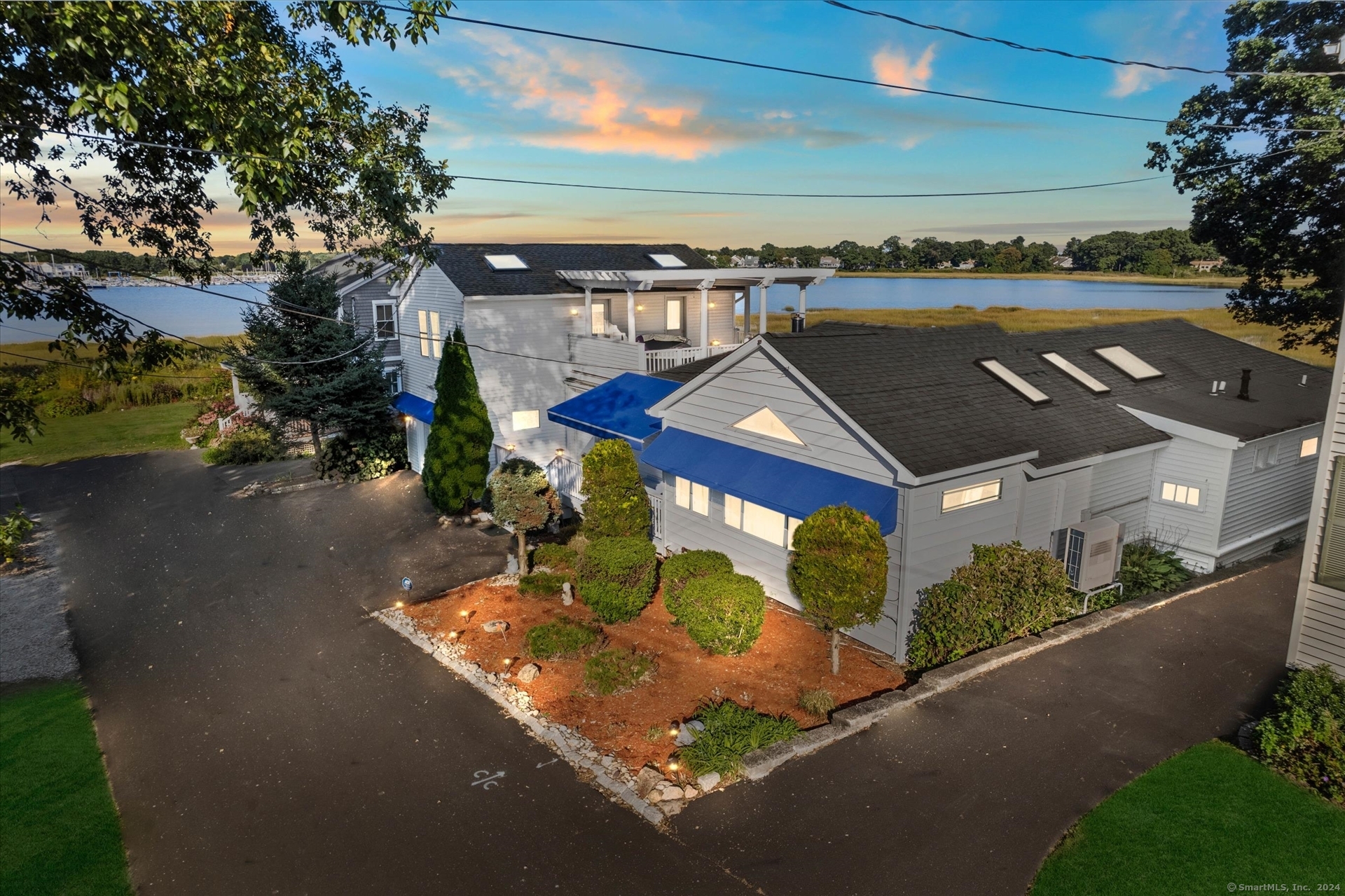 an aerial view of house with yard swimming pool and outdoor seating