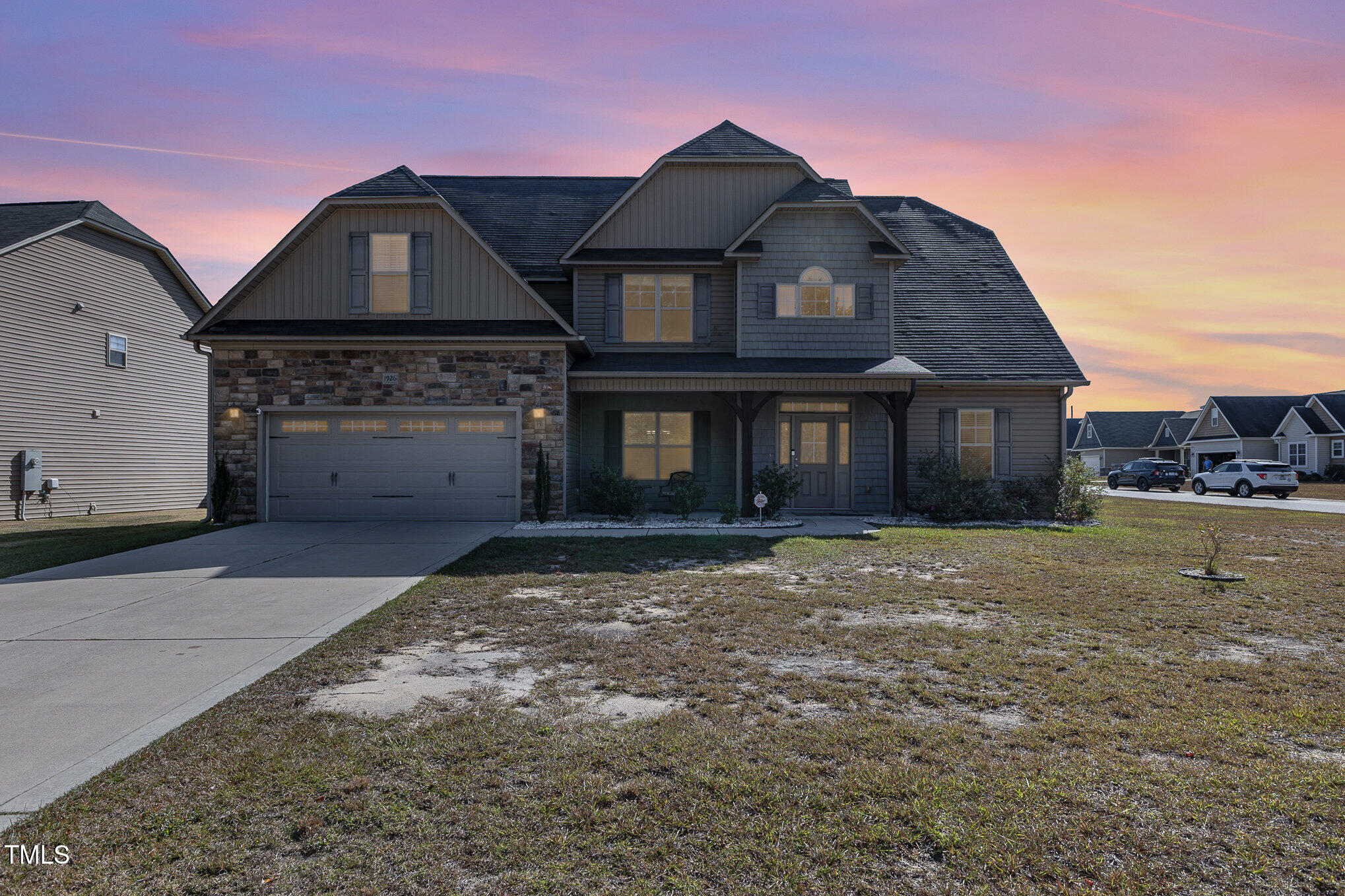 a front view of a house with a yard