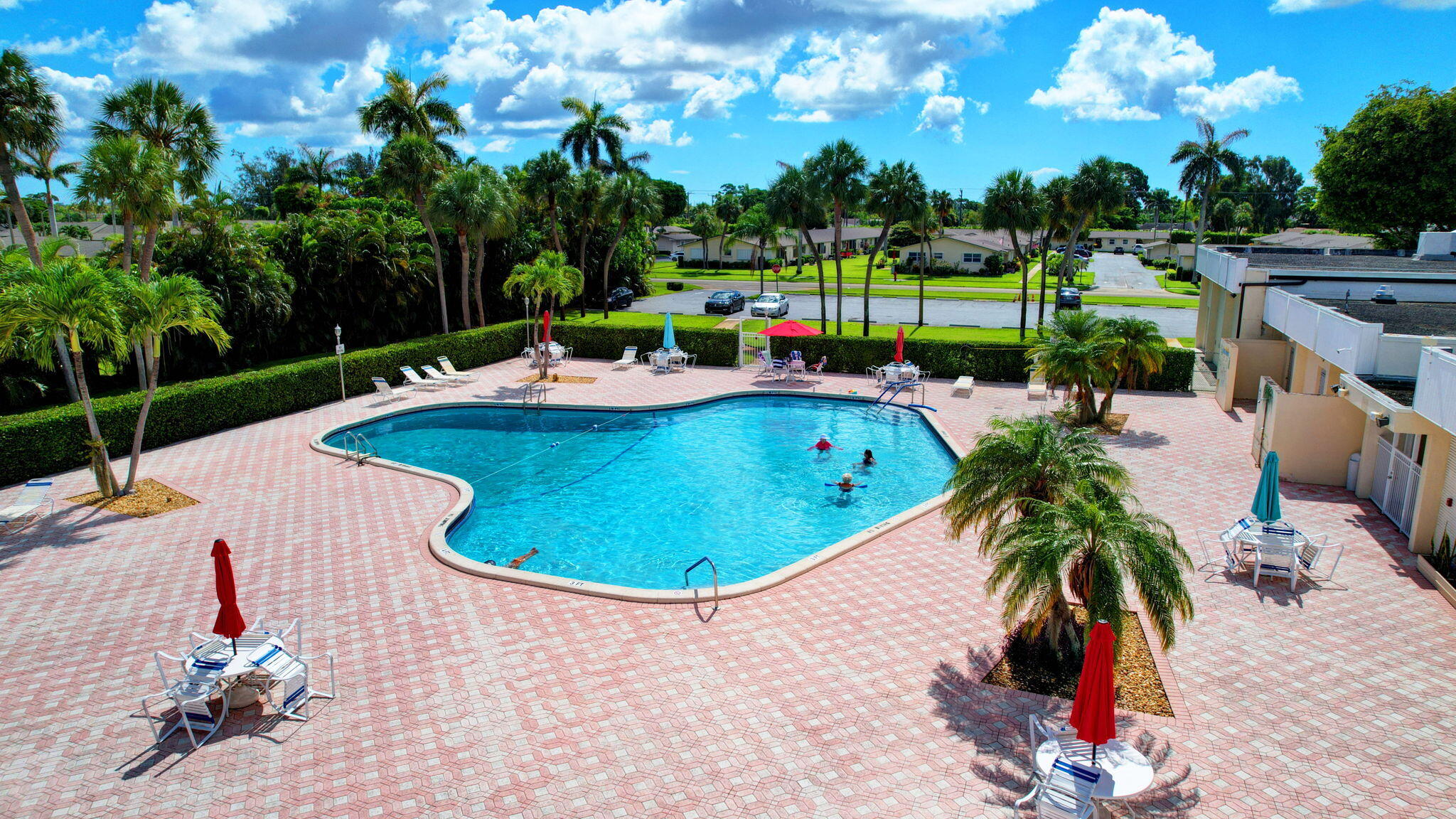 a view of a swimming pool and lounge chairs