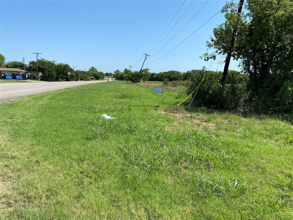 a view of grassy field with trees