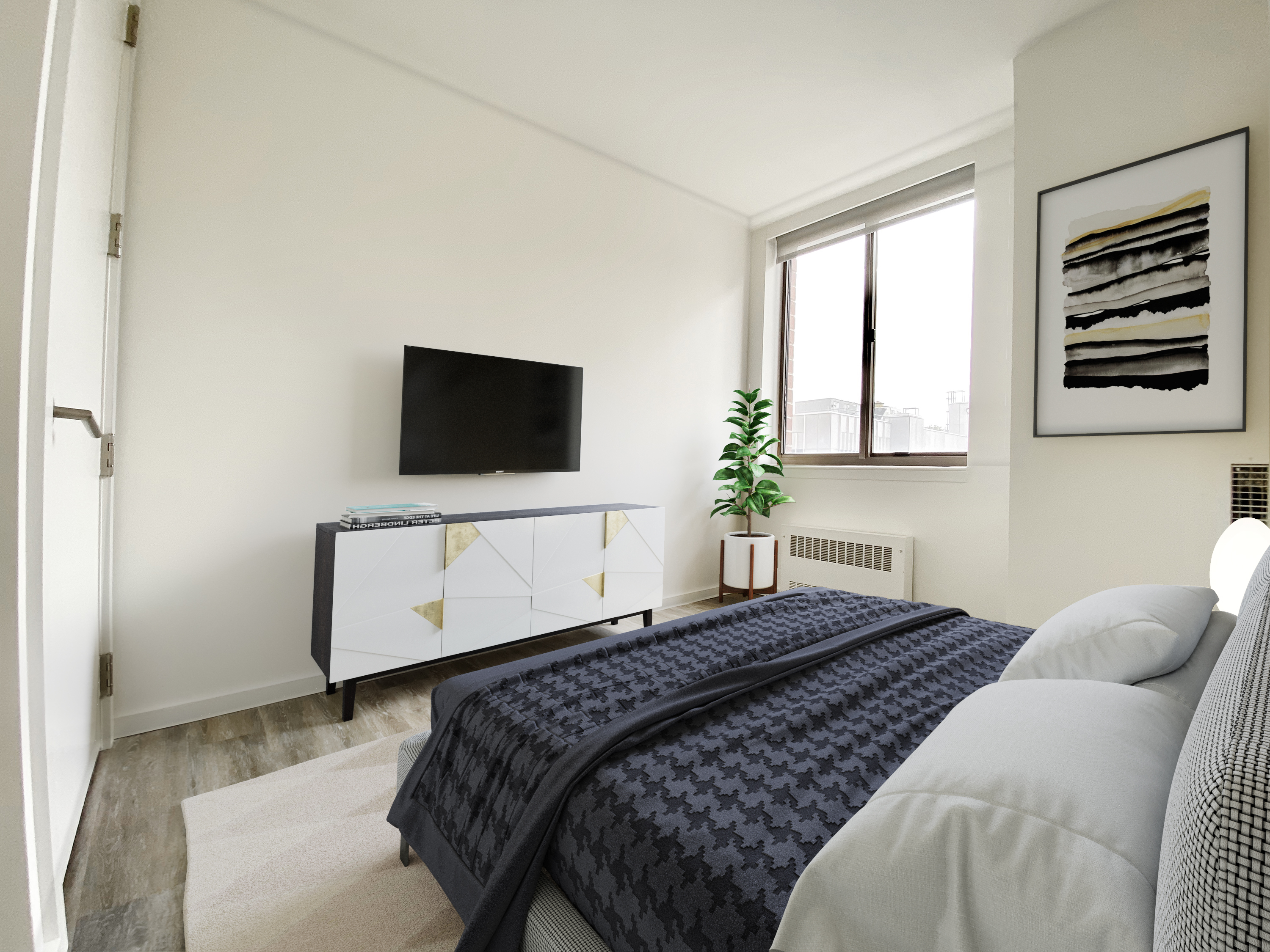 a bedroom with a bed and a flat screen tv