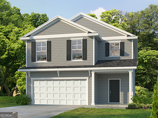 a front view of a house with a yard and garage