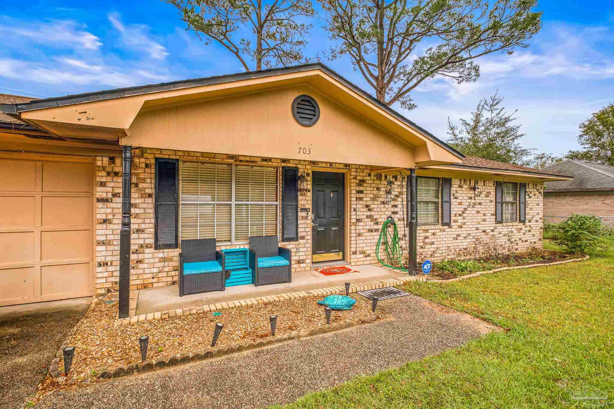 a front view of a house with patio