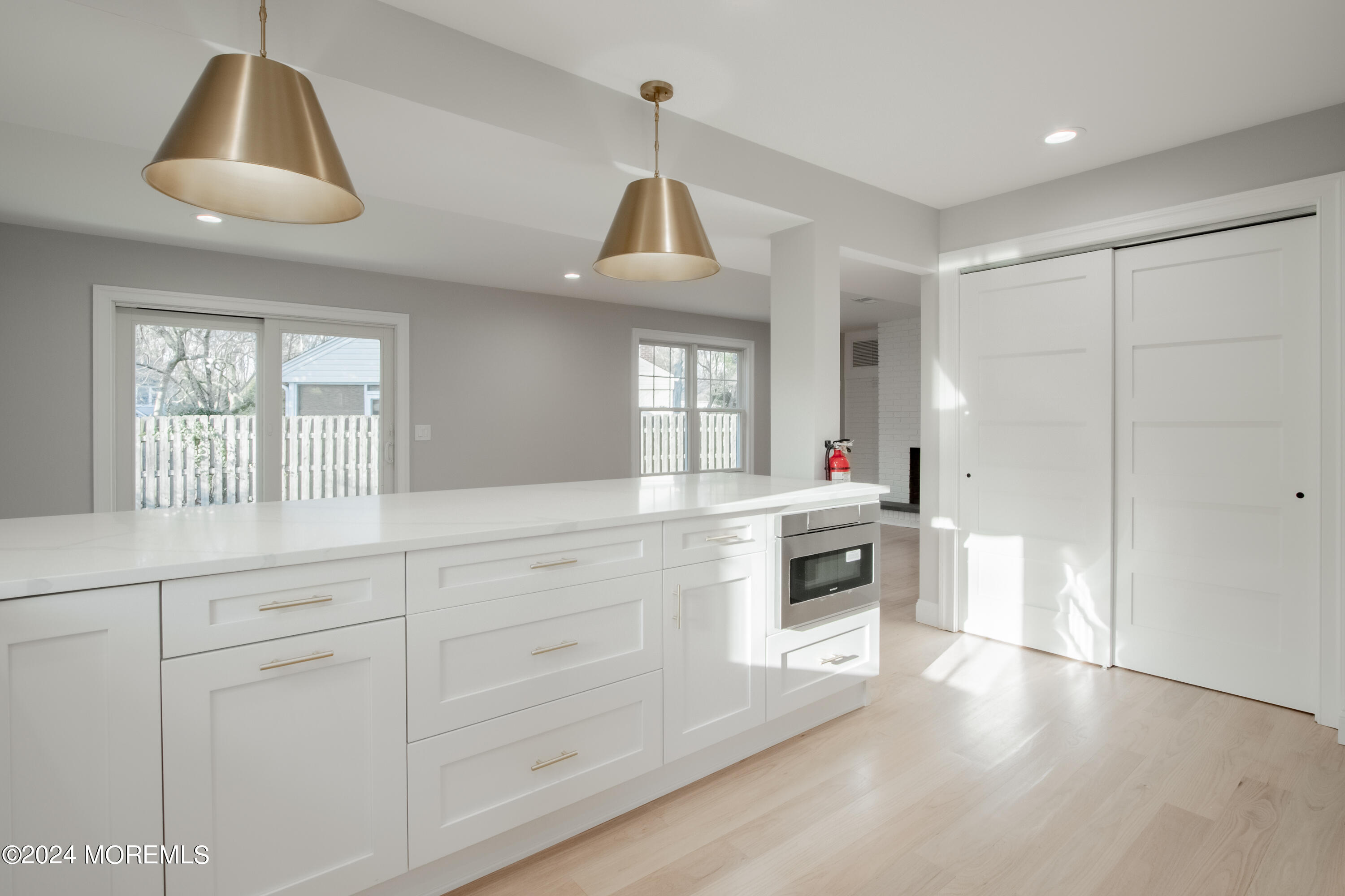 a kitchen with stainless steel appliances a stove a sink and a refrigerator