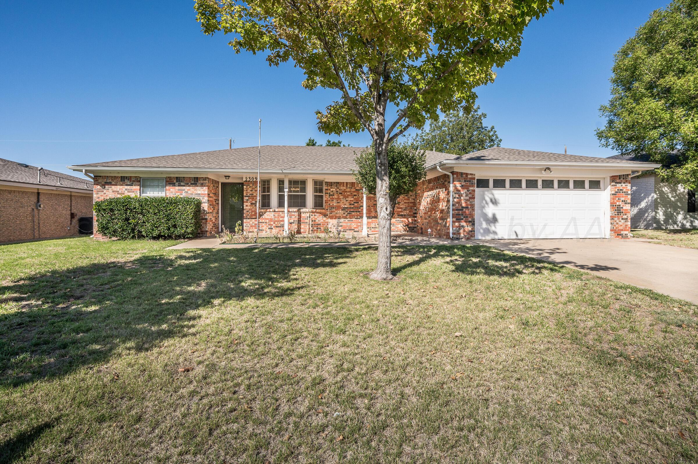 front view of a house with a yard