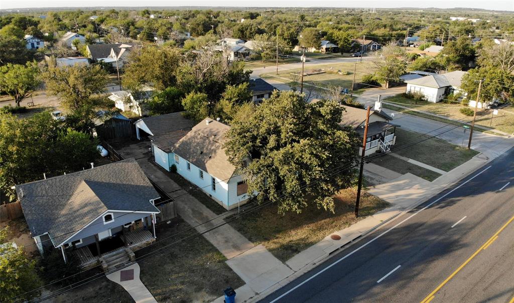 an aerial view of a house with outdoor space