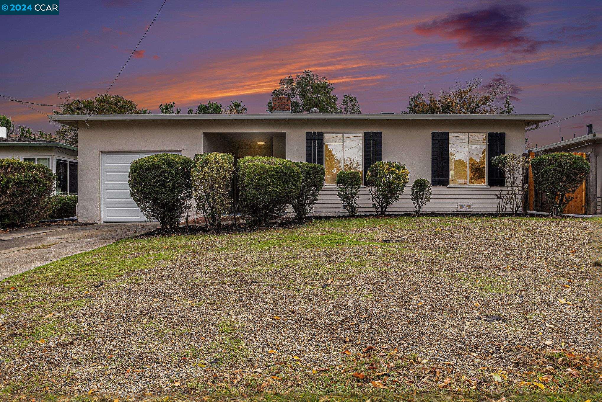 front view of a house with a yard