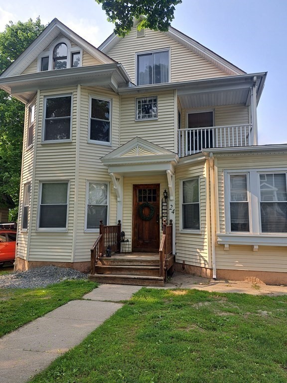 a front view of a house with a yard