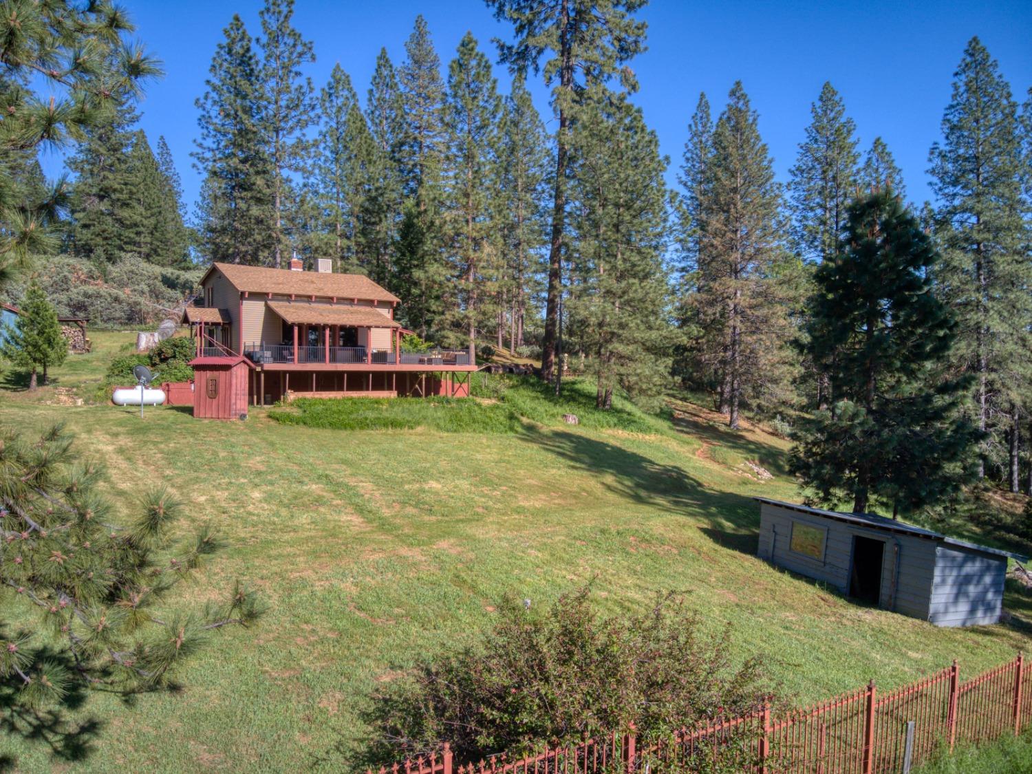 a view of house with outdoor space and sitting area