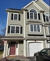 a front view of a house with a lots of windows