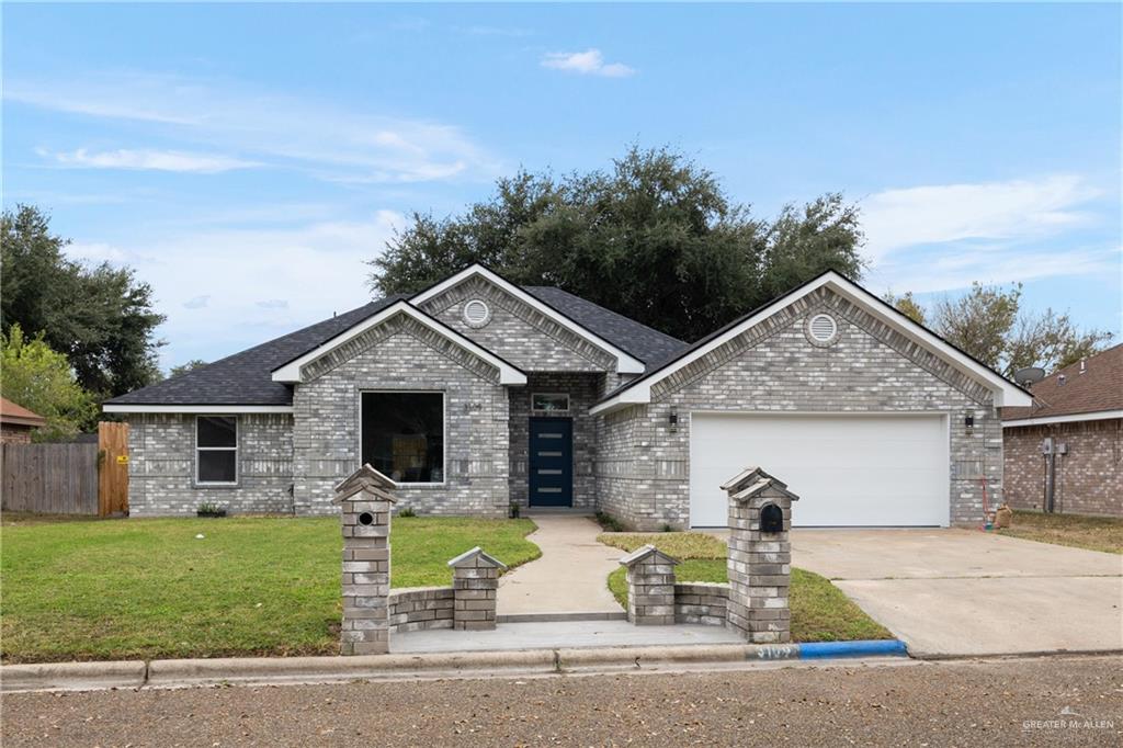 front view of house with a yard