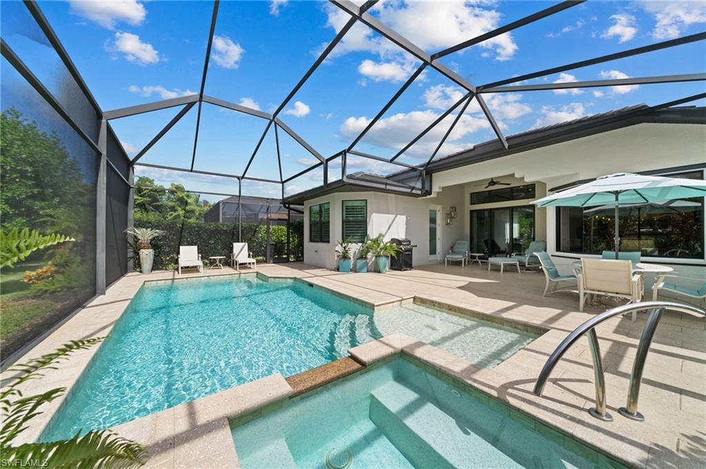 a view of a swimming pool with a patio