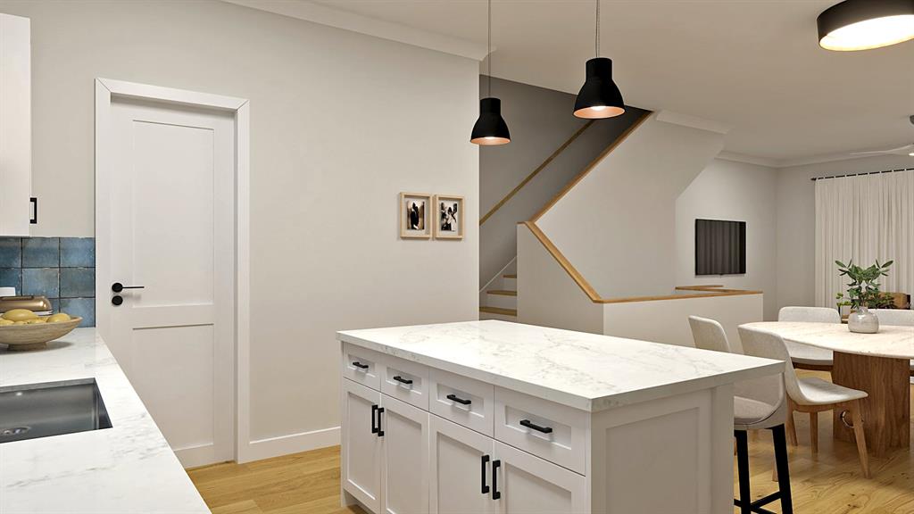 a view of a kitchen with furniture and wooden floor