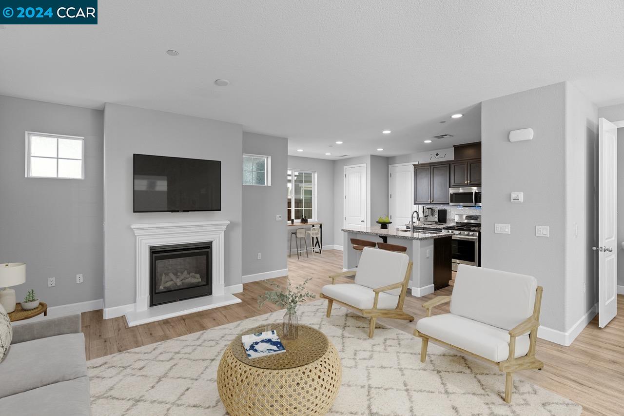 a living room with furniture a rug and a fireplace