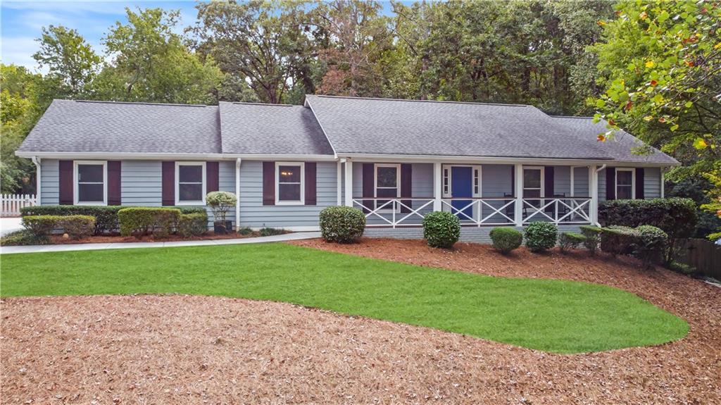 a front view of house with yard and green space