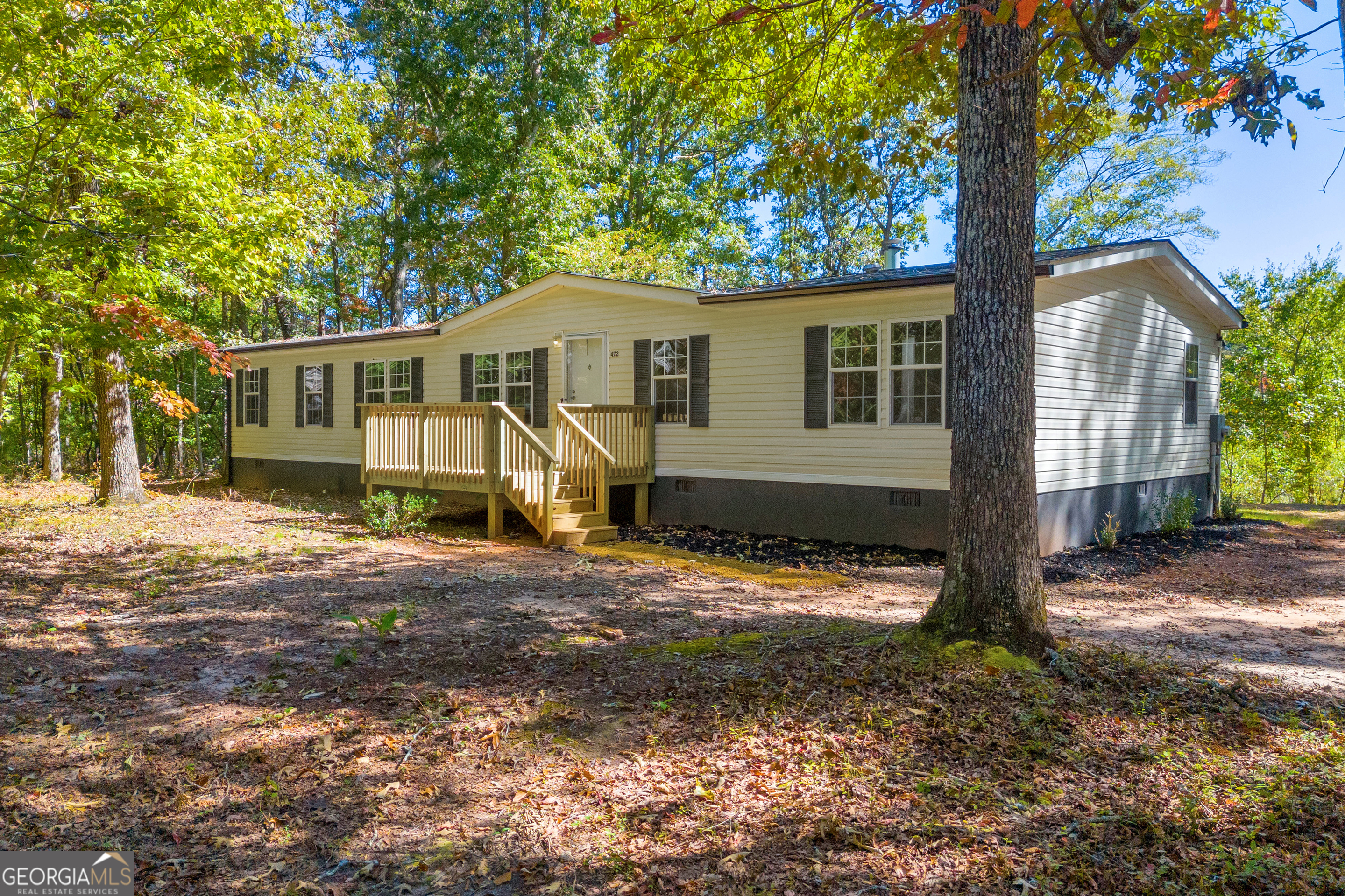 front view of a house with a yard