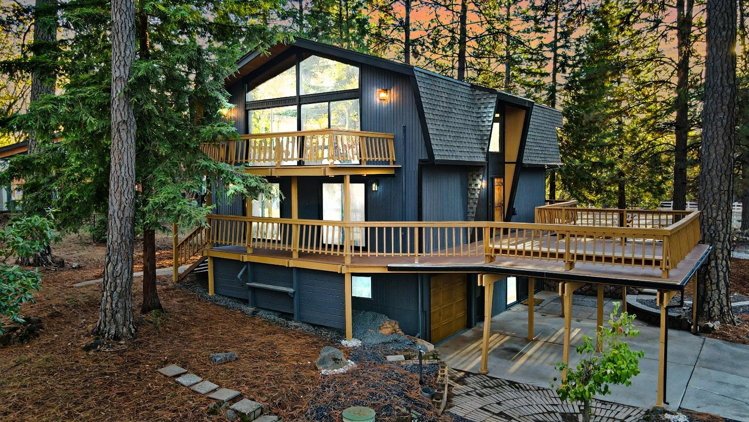 a view of a wooden deck with a yard