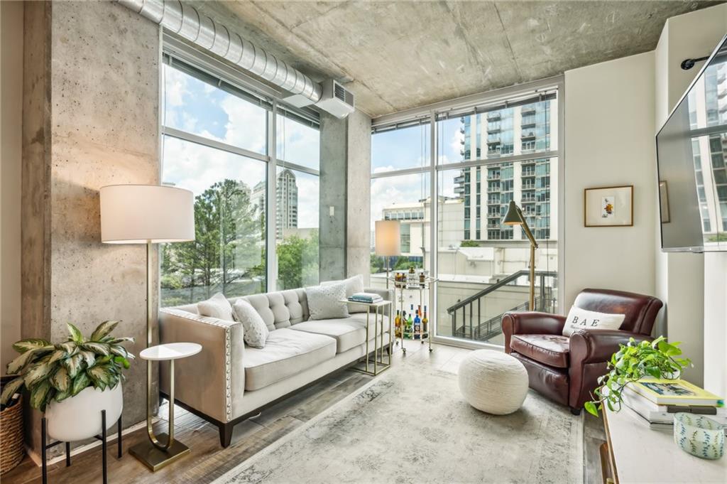 a living room with furniture and a large window