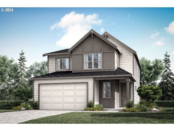 a view of a house with a yard and garage