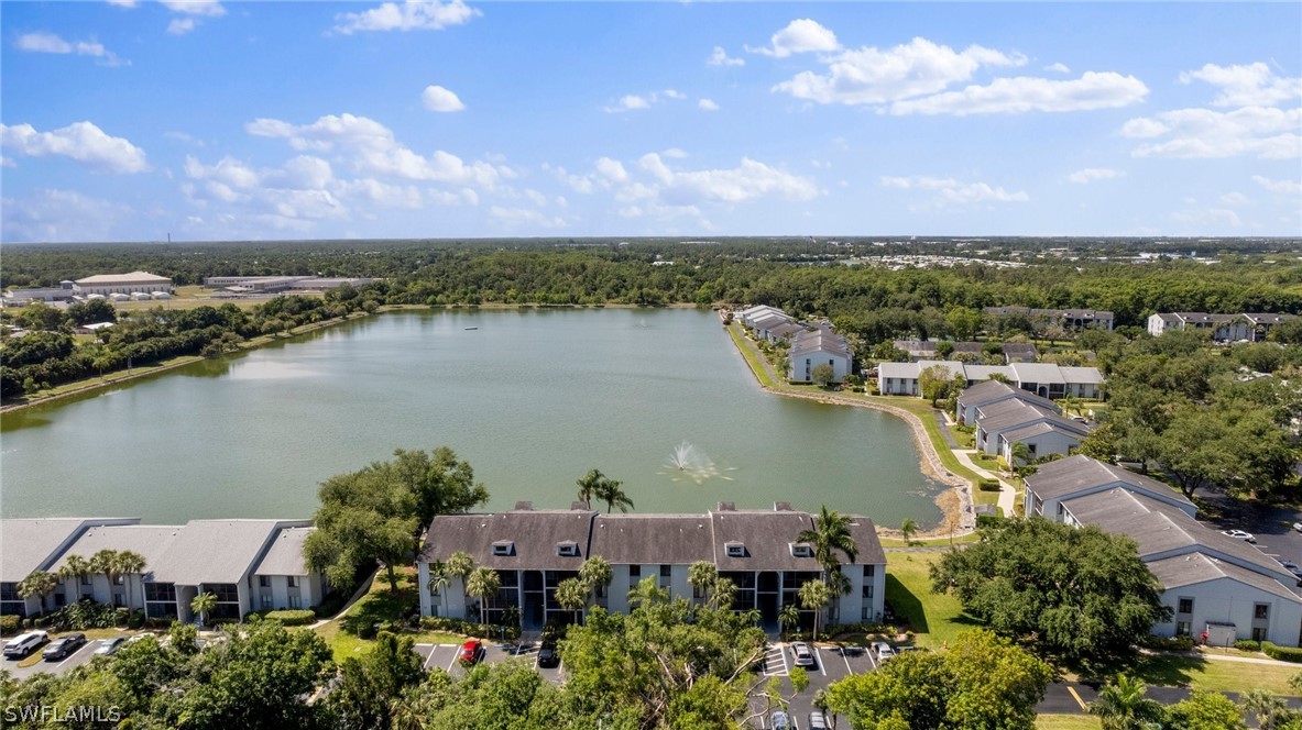 an aerial view of house with lake view