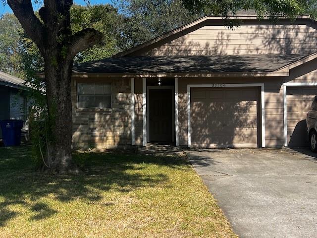 a view of house with backyard outdoor seating and garage