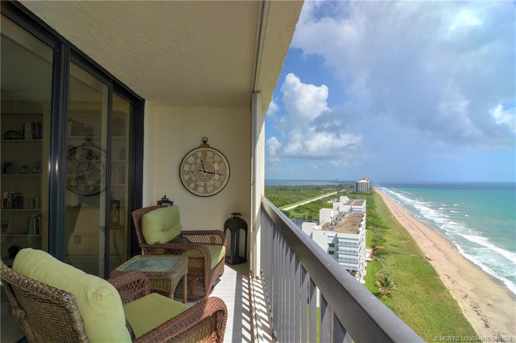 a view of balcony with furniture