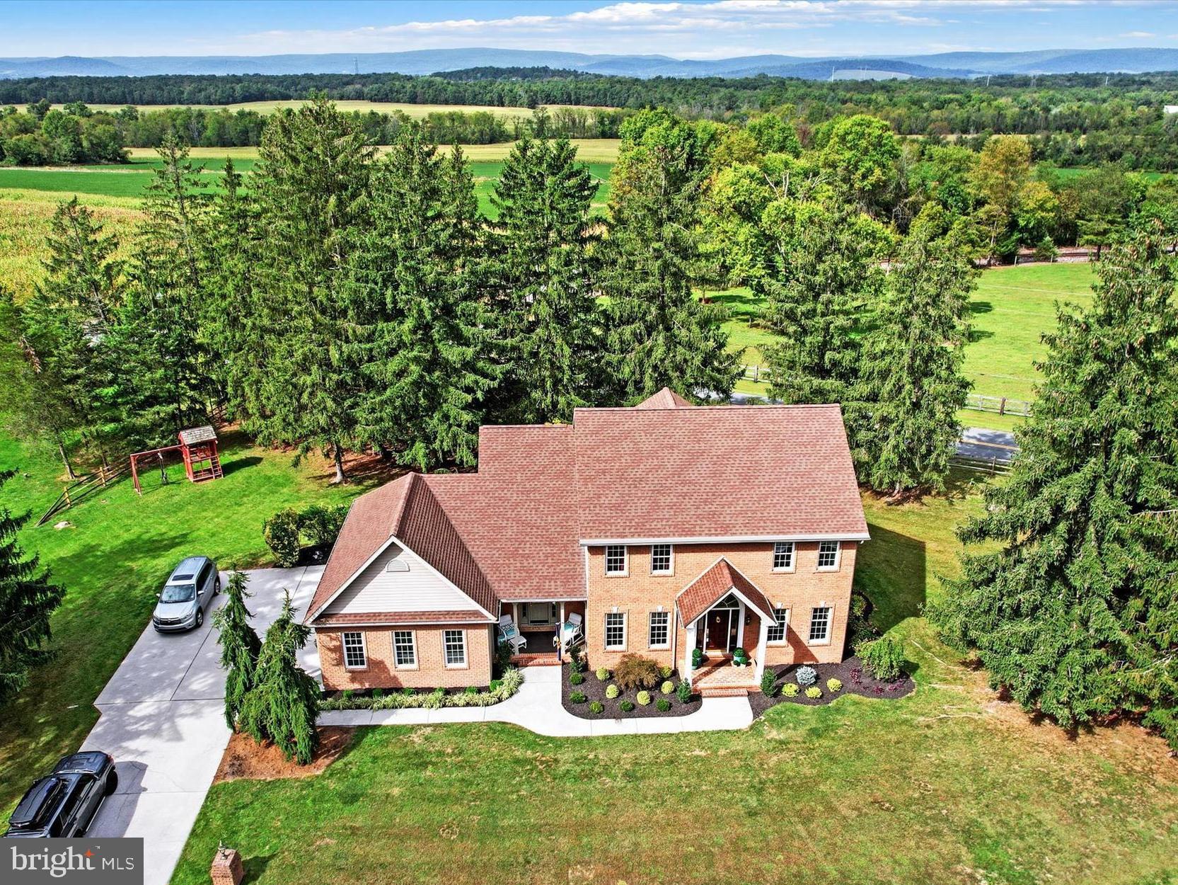 an aerial view of a house with garden