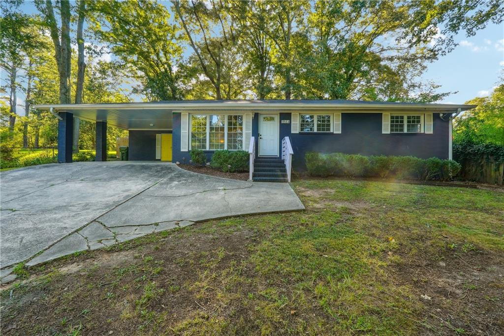 front view of a house with a yard