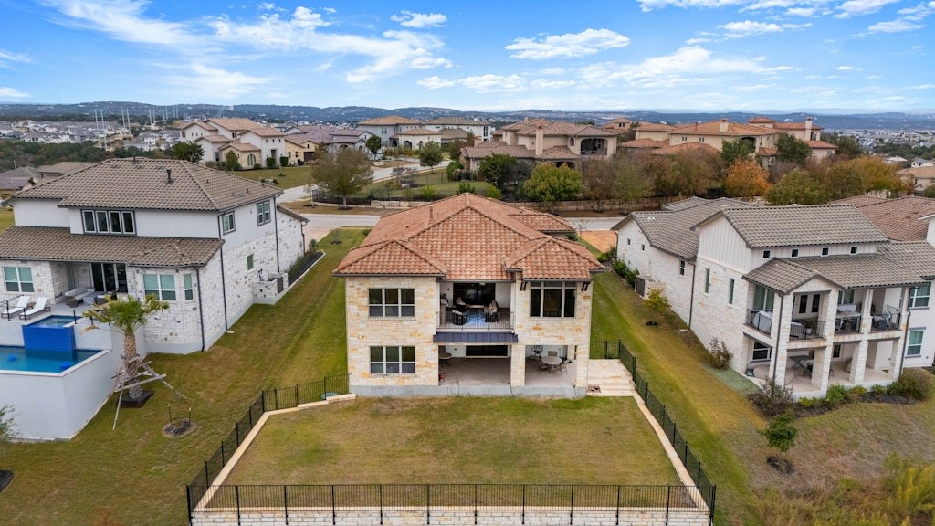 an aerial view of a house with a big yard