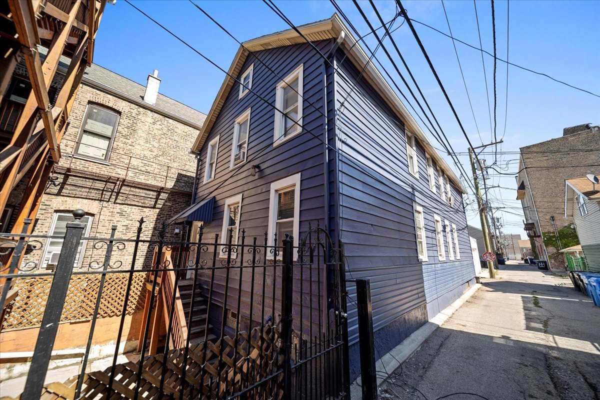 a view of a brick buildings with entryway doors