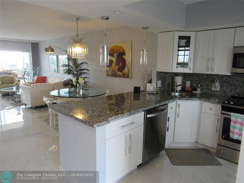 a kitchen with sink and cabinets