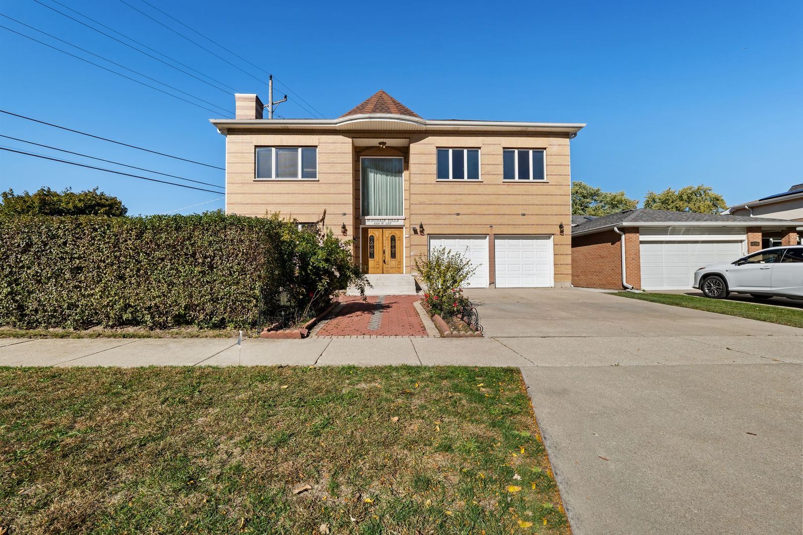 a front view of a house with a yard