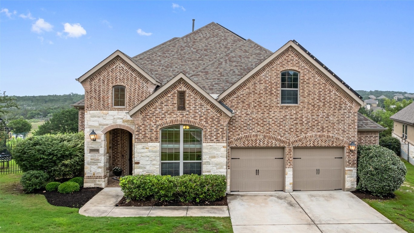 a front view of a house with a yard