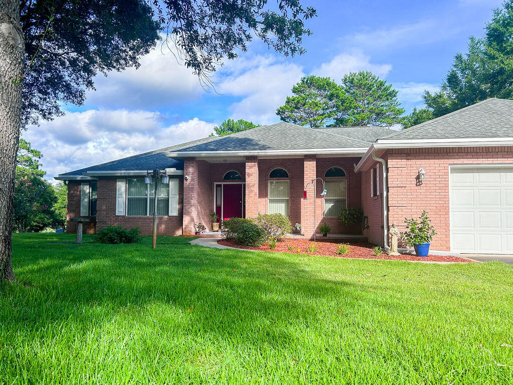 front view of a house with a yard