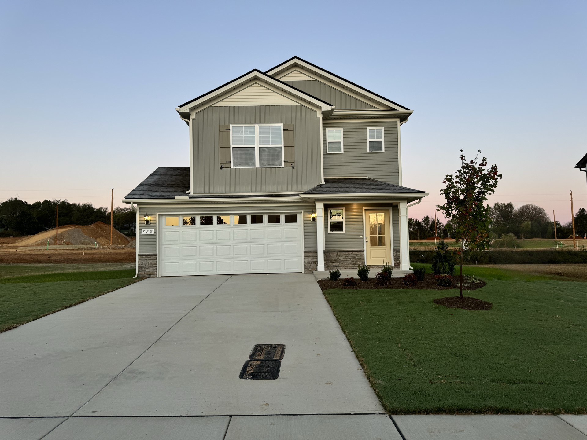 a front view of a house with a yard