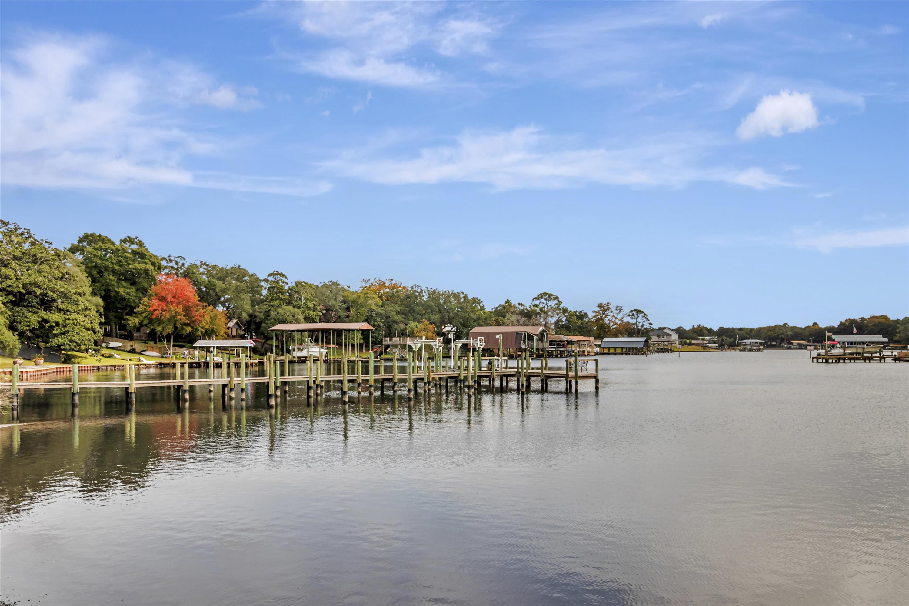 a view of a lake with a table and chairs